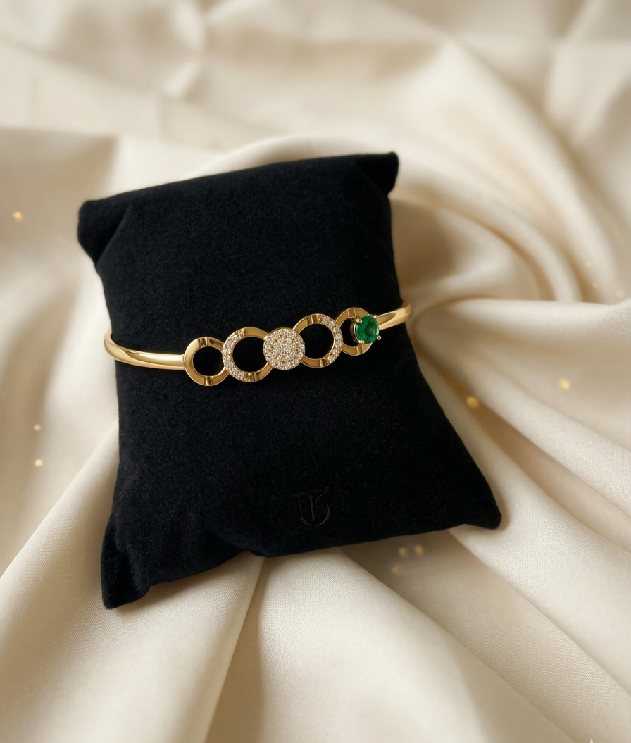 Luminous Link: 24k Gold Plated Emerald Accent Bangle