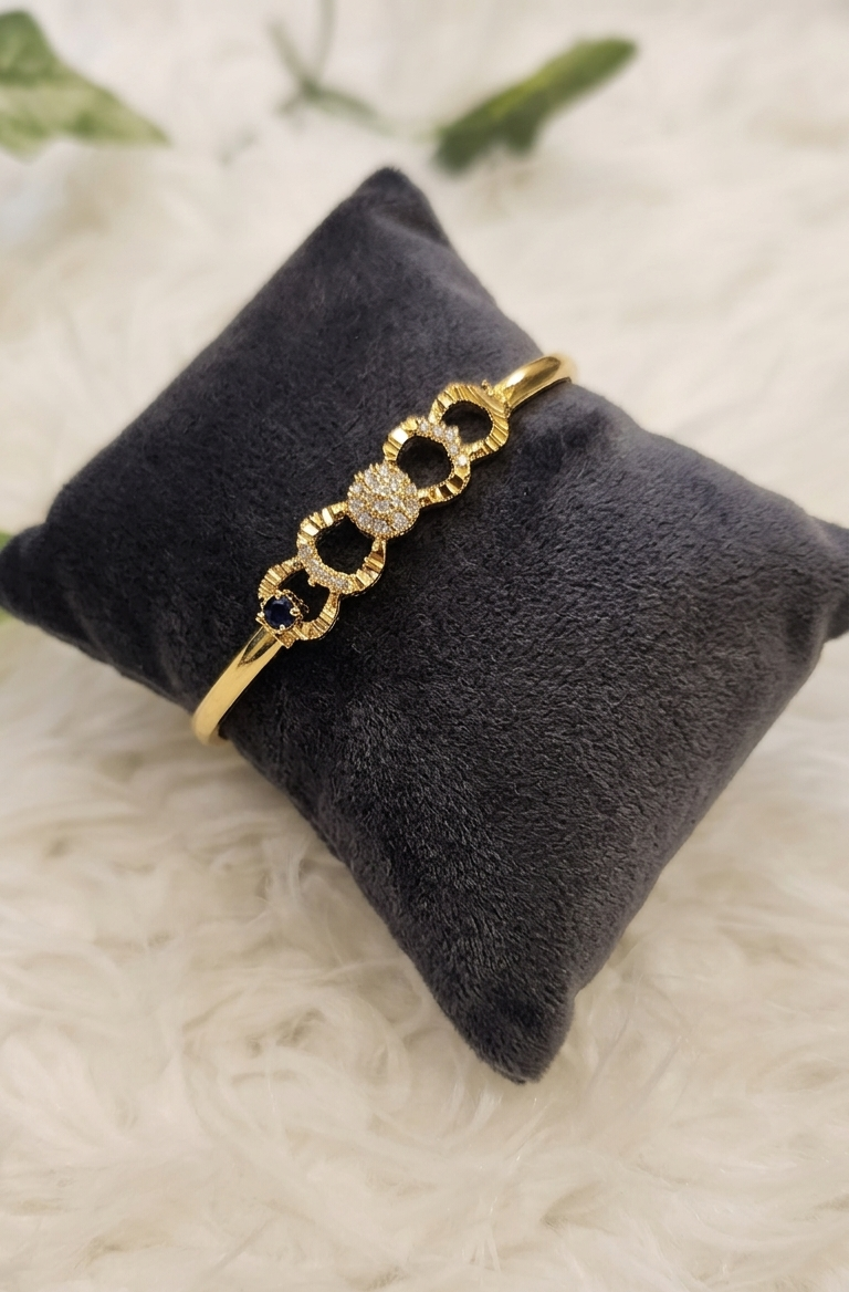 Luminous Link: 24k Gold Plated Emerald Accent Bangle